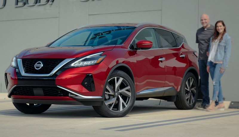 Red Nissan Murano with customers standing next to it at Dingmans Collision Center Red-Nissan-Murano-with-customers-standing-next-to-it-at-Dingmans-Collision-Center